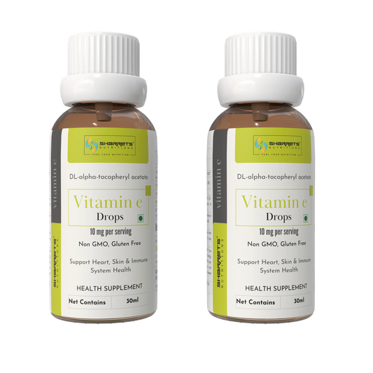 Two bottles of SHARRETS Vitamin E drops with a white background