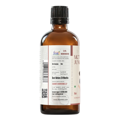Bottle of MCT oil with label on a white background