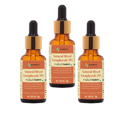Three bottles of Natural Mixed Tocopherols 70% on a white background