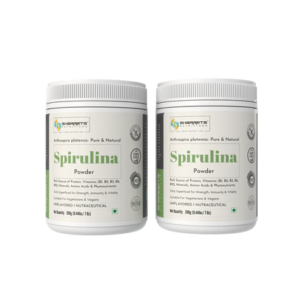 Two containers of sharrets Spirulina Powder on a white background