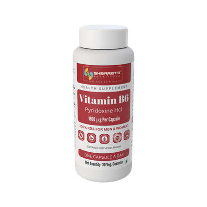 A white plastic bottle of Sharrets Supplements Vitamin B6 Pyridoxine HCl, 1900 µg per capsule, with a white cap and a label featuring red and white sections.