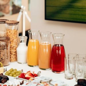 Table with breakfast items including juice, cereal, and fruits - food ingredients- sharrets nutritions
