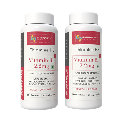 Two bottles of Sharrets Thiamine Hcl Vitamin B1 2.2mg on a white background