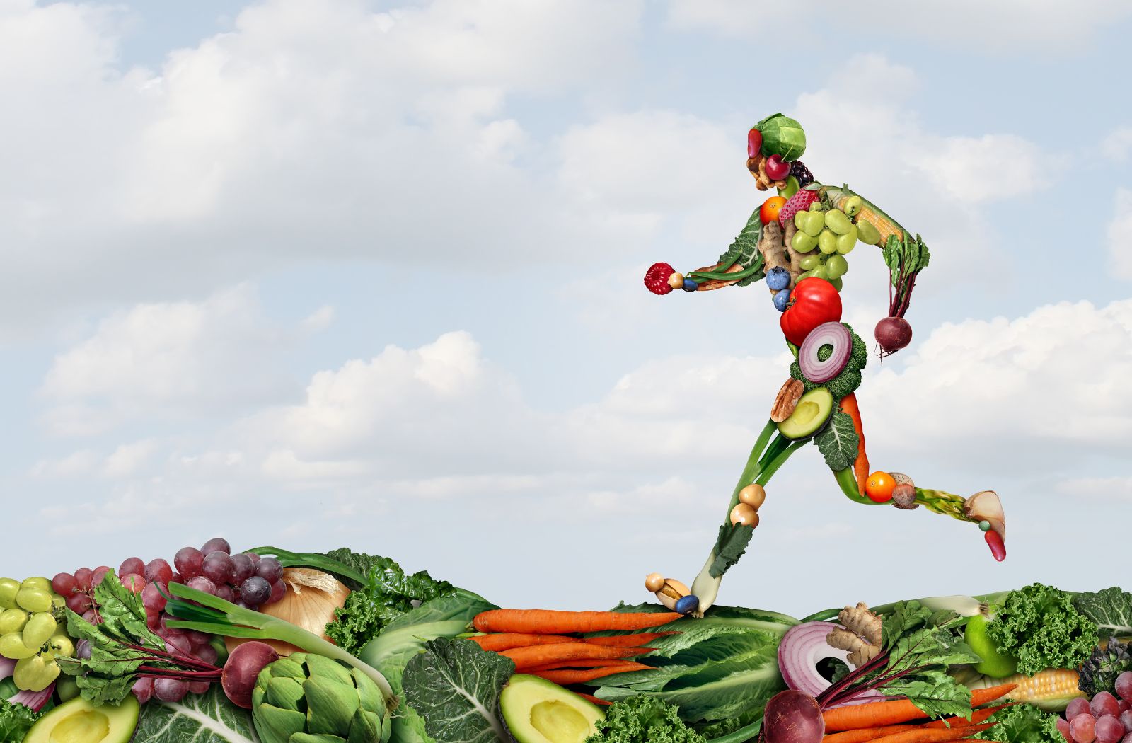 Man made of vegetables running on a bed of fruits and vegetables with a blue sky background