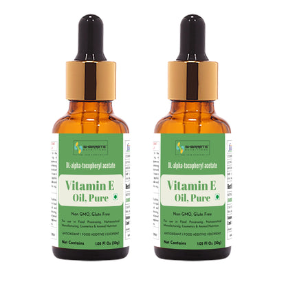 Two bottles of sharrets Vitamin E Oil Pure with dropper caps on a white background