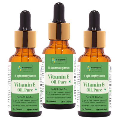 Three bottles of sharrets Vitamin E Oil with dropper caps on a white background