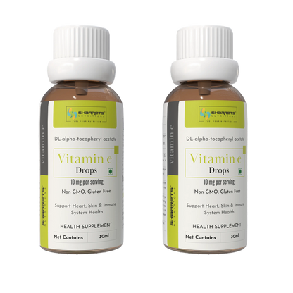 Two bottles of SHARRETS Vitamin E drops with a white background